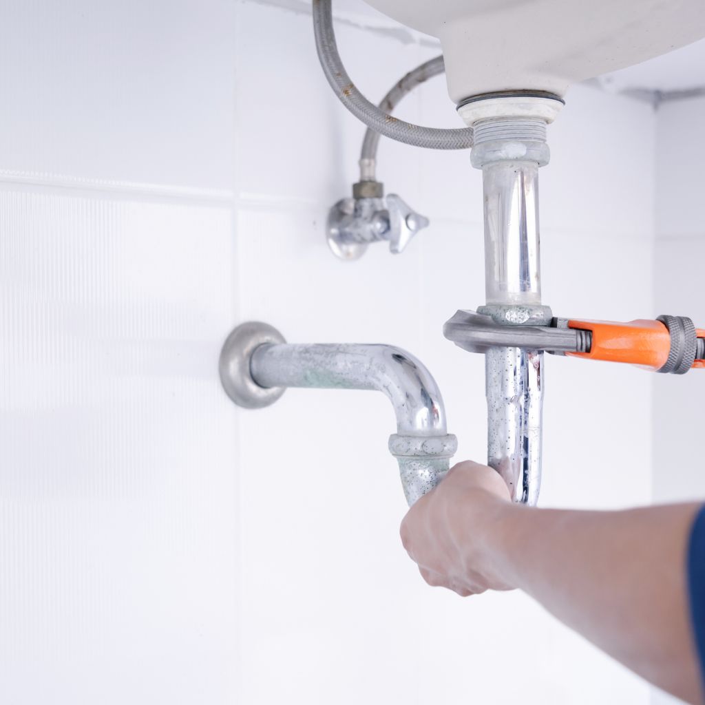 Residential Plumbing image for a plumber servicing a sink.