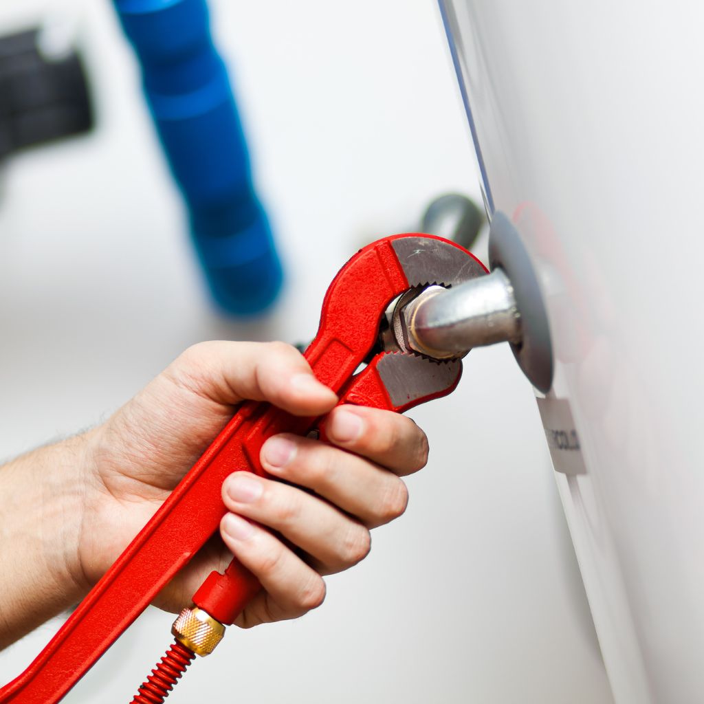 Water treatment image for complete plumbing where a red wrench is repairing a water heater or water softener.