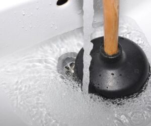 A Clean drain and running water with a plunger and OxiClean Unclogged the Drain!