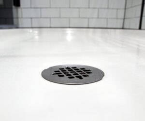A clean shower drain after the gurgle has been repaired by Complete Plumbing and Drain for healthy home's plumbing system.