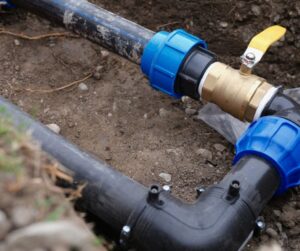 Plumbing in the ground being inspected after hurricane season.